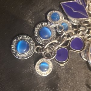 2 coach keychains with charms